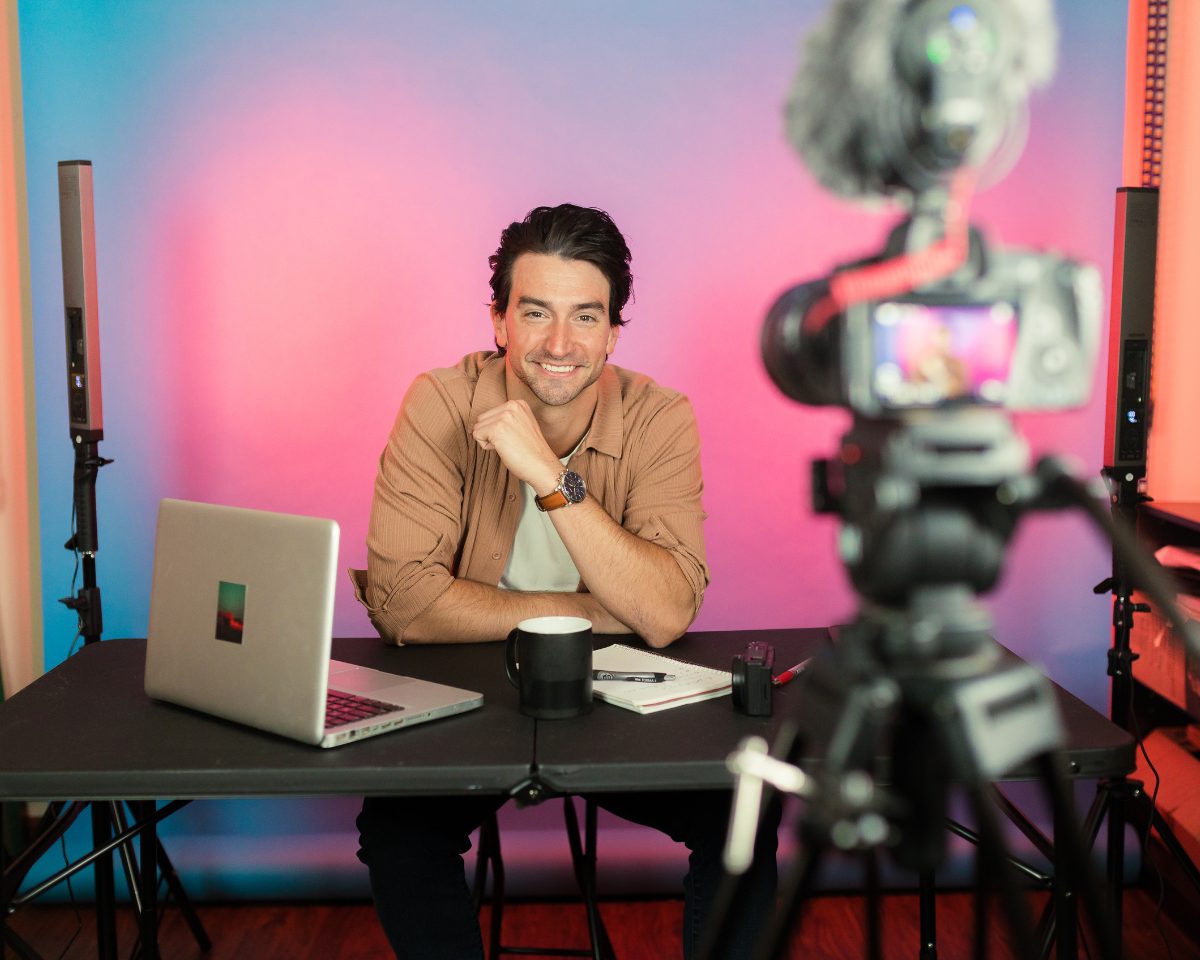 Content creator filming setup with camera and laptop